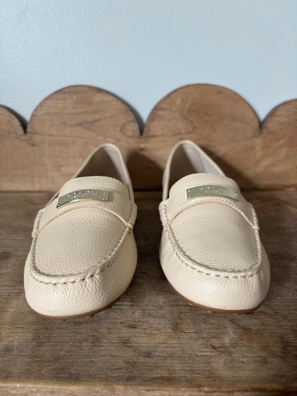 Coach Cream Pebbled Leather Loafers with Metal Plaque